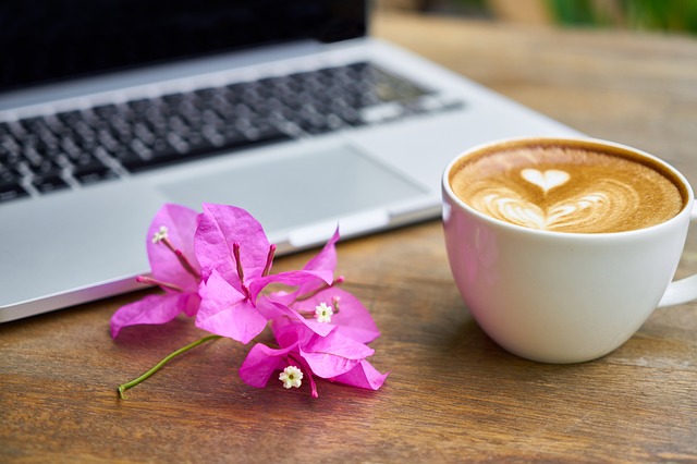 cup of coffee, laptop, flower